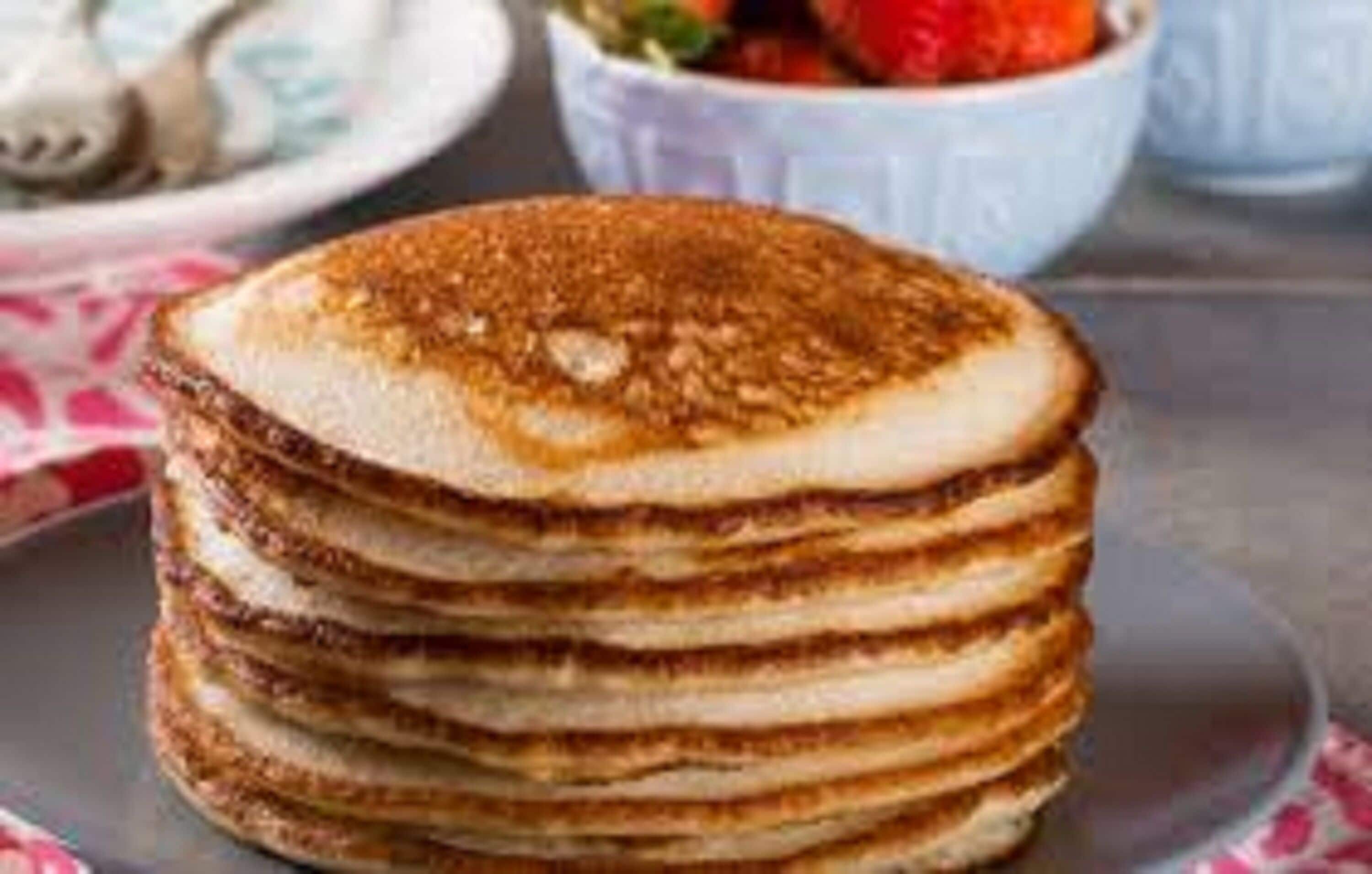 A stack of pancakes on a plate.