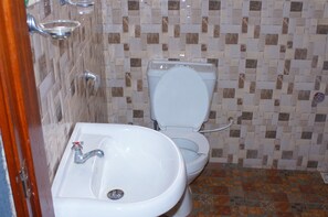 Shower, rainfall showerhead, towels, soap