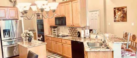 Microwave, dishwasher, coffee/tea maker, cookware/dishes/utensils