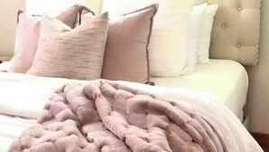 A bed with a tufted headboard, multiple pillows, and a blanket. - Yoga & Peaceful, Elegant, Bohemian Vibes Surrounded by Forest (Blairsville)