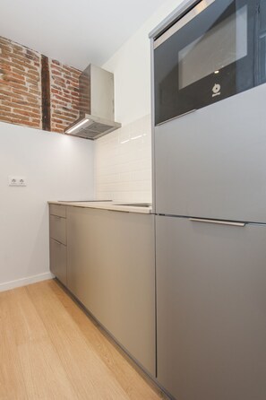 Fridge, microwave, coffee/tea maker, cookware/dishes/utensils