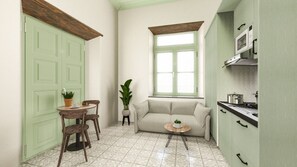 A compact living space with a kitchenette, a dining area with a table and chairs, a sofa, and a window providing natural light.