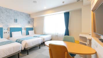 A hotel room with two beds, a desk, a chair, a TV, and a window with curtains.