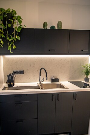 Microwave, coffee/tea maker, cookware/dishes/utensils, paper towels