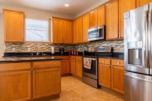 House (Trafalgar Resort community pool and G) | Private kitchen | Oven, coffee/tea maker, toaster, blender - Marg Retreat by Orlando Short Term (Kissimmee)