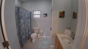 Bathtub, hair dryer, towels, soap