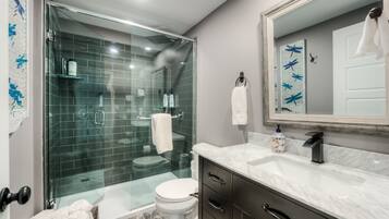 Shower, rainfall showerhead, hair dryer, towels