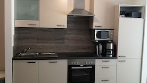 Apartment | Private kitchen | Stovetop, dishwasher - Landhaus Kaisershof - Ferienwohnungen mit Spa und Sport (Wangerland)