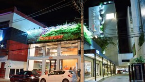 A restaurant with a green awning and a sign that reads "Restaurante". - Ramada Encore Centro (São Paulo)