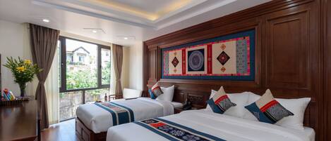A hotel room with two beds, a wooden headboard, a large window, and a view of the outside.
