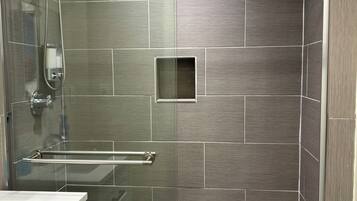 Combined shower/bathtub, hair dryer, towels, soap