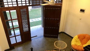 A staircase leading to a room with a view of a garden, a ceiling fan, and two bean bag chairs. - Ravan Tangalle (Tangalle)