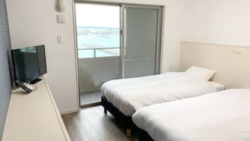 Apartamento família, 2 quartos, vista para o oceano | Cortinas blackout, ferros/tábuas de passar roupa, Wi-Fi de cortesia