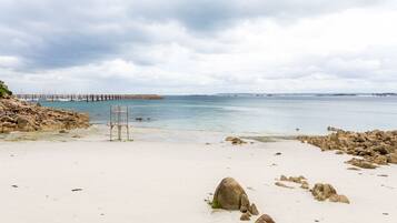 On the beach, sun-loungers
