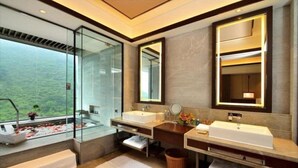 A modern bathroom with two sinks, a large mirror, and a glass shower enclosure. - Hongzhushan Hotels and Resorts Chanyi Shanju (Leshan)