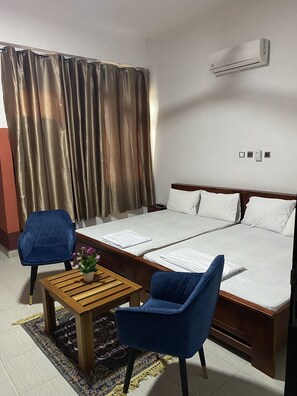 Family Double or Twin Room, 2 Double Beds | Individually furnished, desk, laptop workspace, blackout drapes - Thesyl Hotel (Sunyani)