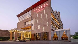 A modern building with the name 'RAMADA BY WYNDHAM' prominently displayed. - Ramada By Wyndham Aligarh Gt Road (Aligarh)