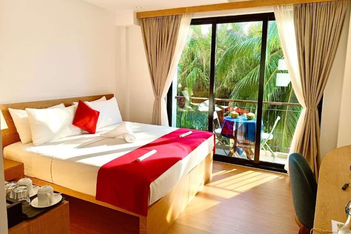 Deluxe Double Room, Balcony | In-room safe, desk, laptop workspace, blackout drapes