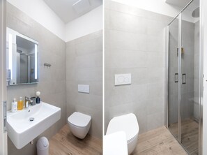 Apartamento superior (101-102) | Banheiro | Chuveiro, chuveiro com efeito de chuva, secador de cabelo, piso aquecido