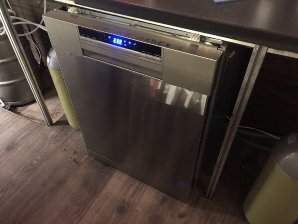 A stainless steel dishwasher in a kitchen with a digital display. - Whole basement pub1 for stag do/30person (VIII. kerület)