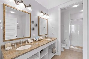 Shower, hair dryer, towels, shampoo