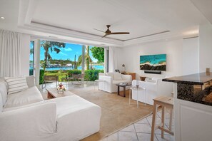 Spacious 1 Bedroom, 1 Bathroom (C3) | Living area | LED TV - The Yacht Club TC (Providenciales)