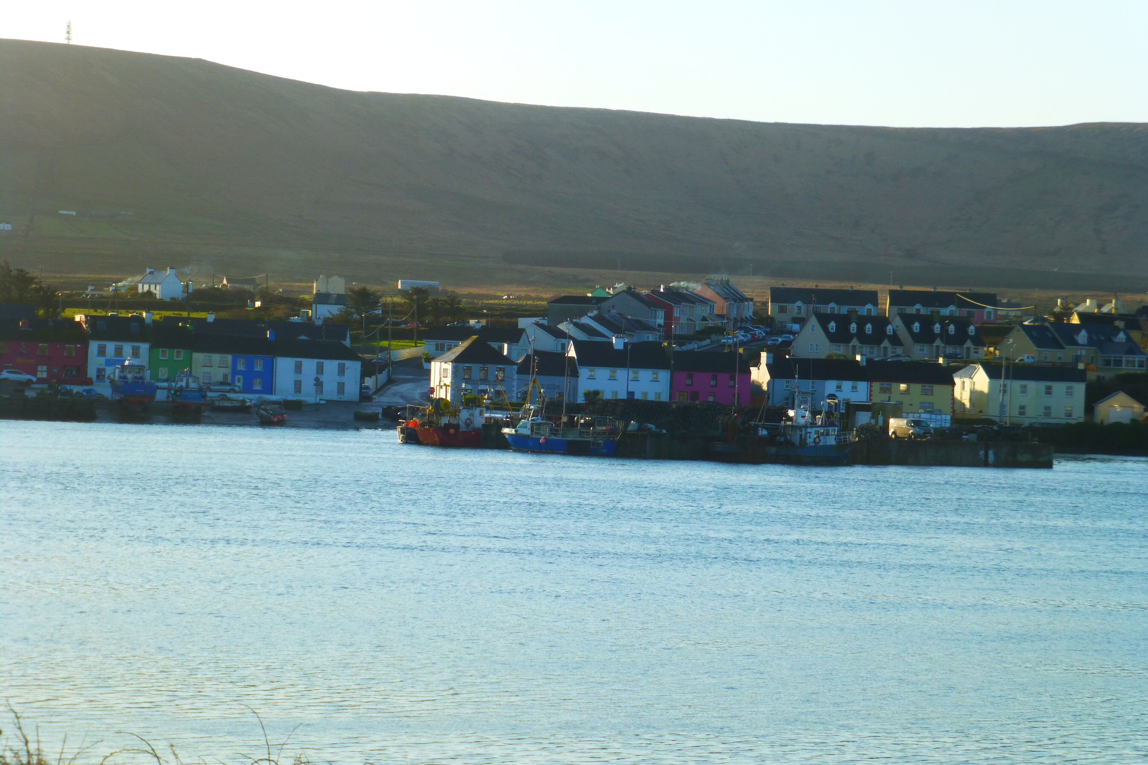 A coastal town with colorful houses by the water.
