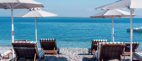 On the beach, sun loungers