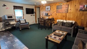 Living area - Majestic Recreational Lodging w/ Snowmobile and Side x Side rentals on Long Lake (Sinclair)