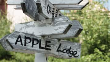 Explore the great outdoors with our directional signpost, guiding you to nearby destinations like APPLE Lodge and OH.