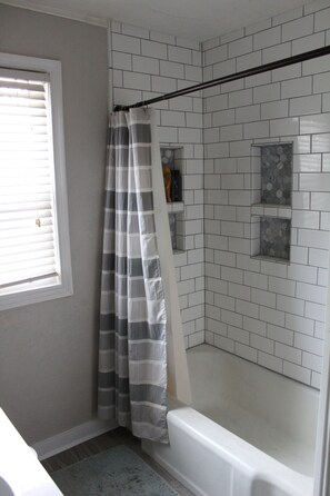 Combined shower/tub, hair dryer, towels, soap