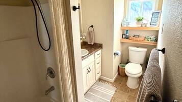 Combined shower/tub, hair dryer, towels, soap