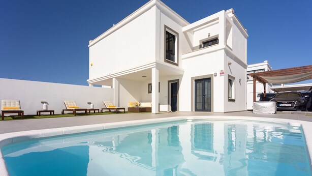 A modern two-story building with a swimming pool in front. - TEBAR BEACH in Playa Blanca (Playa Blanca)