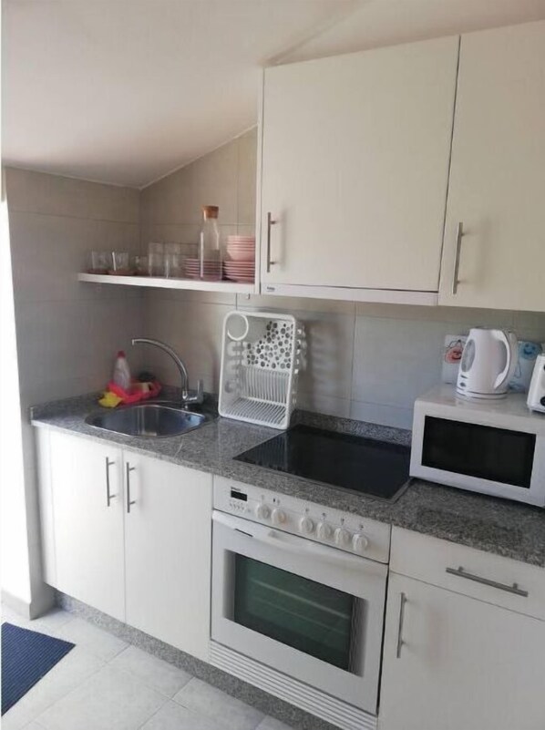 Fridge, oven, electric kettle, toaster