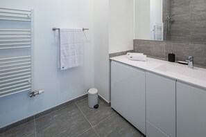 Bathtub, hair dryer, towels