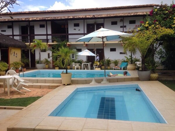 Outdoor pool, open 9:00 AM to 8:00 PM, pool loungers