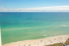 A beach with clear turquoise waters and a sandy shore. - Girasole Apartments (Miami Beach)