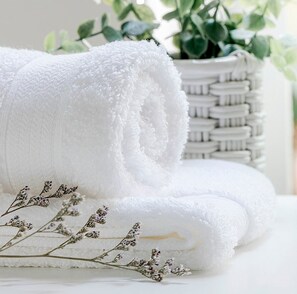 A neatly folded white towel, a woven basket, and dried lavender stems. - Oceanside, 6 BRs, Private Pool, Ocean Views, Foosball, O2, Topside (Duck)