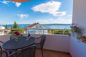 Enjoy a serene lake view from this balcony, perfect for sipping a drink or dining al fresco.