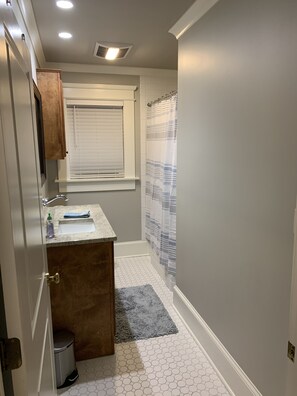 Combined shower/tub, hair dryer, towels, soap