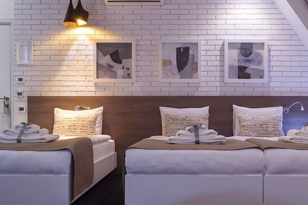 Triple Room | Minibar, in-room safe, desk, soundproofing