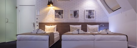 Triple Room | Minibar, in-room safe, desk, soundproofing