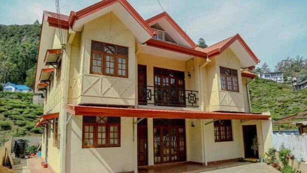 A two-story building with a balcony, large windows, and a traditional architectural style. - The Sudbury Villa Nuwaraeliya (Nuwara Eliya)