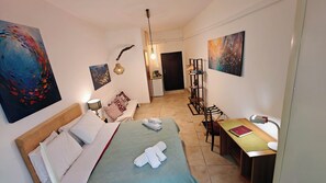 1 bedroom, desk, iron/ironing board, travel crib