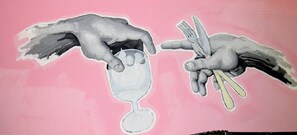 A wall with a pink background and two hands reaching for a glass and utensils.