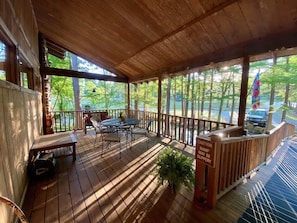 Huge double front porches overlooking the pond/creek. 