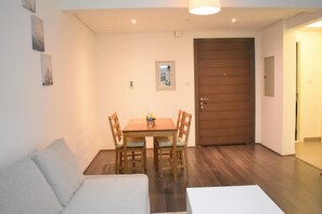 Deluxe Apartment | Living area | LCD TV