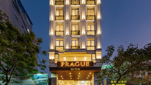 A tall hotel with a prominent sign reading "Prague Hotel." - Prague Hotel (Da Nang)