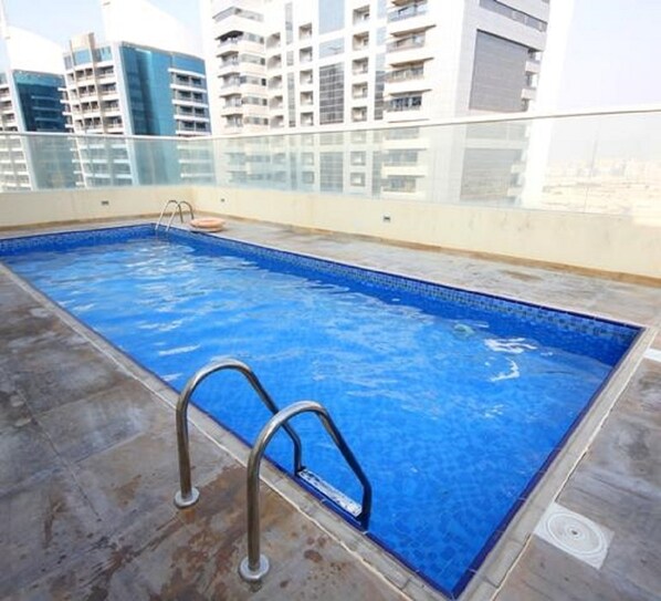 Outdoor pool - Beautiful One Bedroom Apartment in Tecom (Dubai)