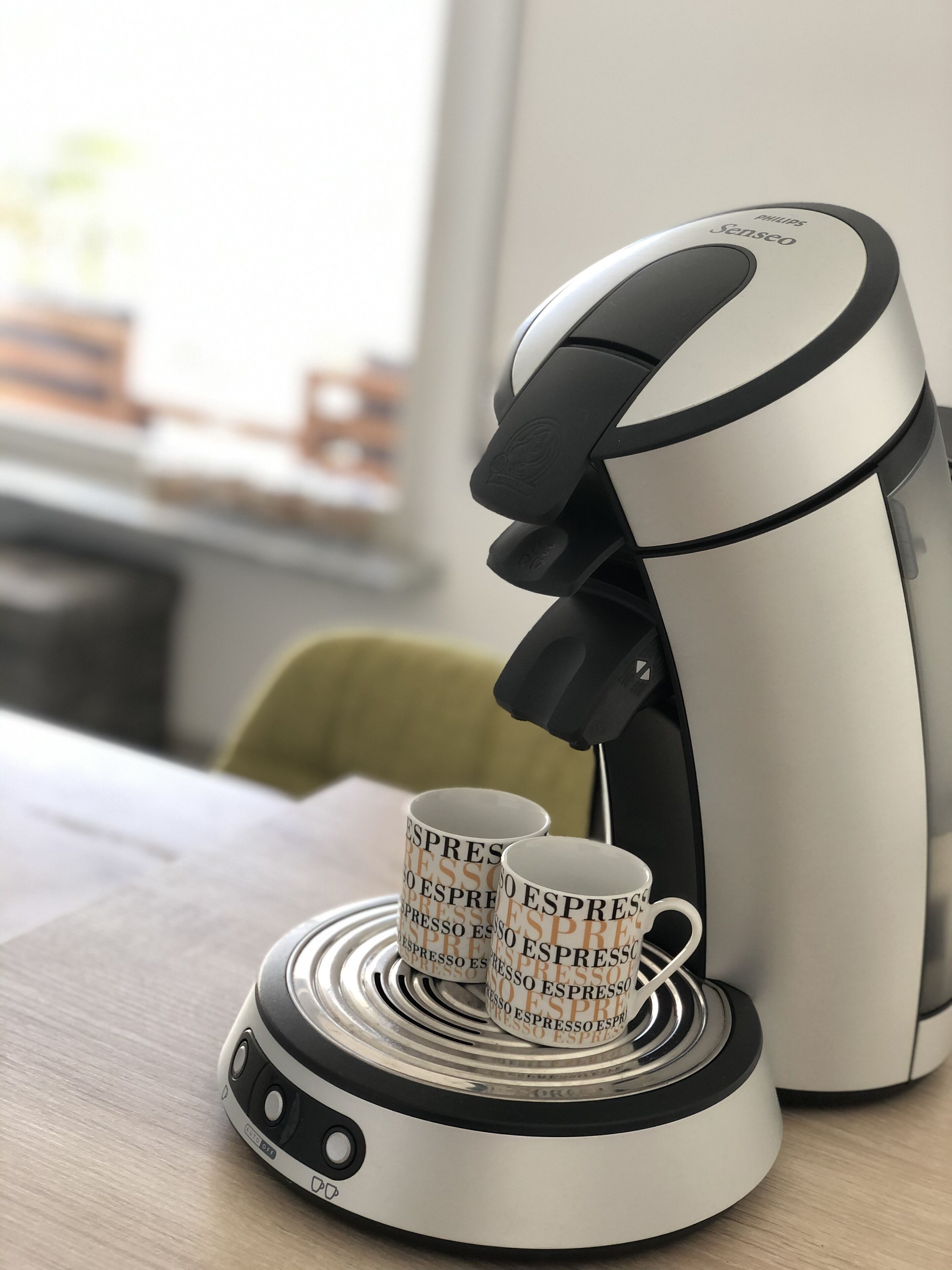 A coffee machine with two cups on a coaster, both labeled "ESPRESSO ESPRESSO ESPRESSO ESPRESSO ESPRESSO ESPRESSO ESPRESSO ESPRESSO ESPRESSO ESPRESSO ESPRESSO ESPRESSO ESPRESSO ESPRESSO ESPRESSO ESPRESSO ESPRESSO ESPRESSO ESPRESSO ESPRESSO ESPRESSO ESPRESSO ESPRESSO ESPRESSO ESPRESSO ESPRESSO ESPRESSO ESPRESSO ESPRESSO ESPRESSO ESPRESSO ESPRESSO ESPRESSO ESPRESSO ESPRESSO ESPRESSO ESPRESSO ESPRESSO ESPRESSO ESPRESSO ESPRESSO ESPRESSO ESPRESSO ESPRESSO ESPRESSO ESPRESSO ESPRESSO ESPRESSO ESPRESSO ESPRESSO ESPRESSO ESPRESSO ESPRESSO ESPRESSO ESPRESSO ESPRESSO ESPRESSO ESPRESSO ESPRESSO ESPRESSO ESPRESSO ESP